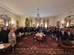 Greek-American Day School students sing carols to the Archbishop