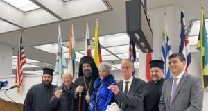 Metropolitan Nathanael joins public officials in cutting of the Vasilopita celebration
