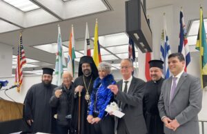 Metropolitan Nathanael joins public officials in cutting of the Vasilopita celebration