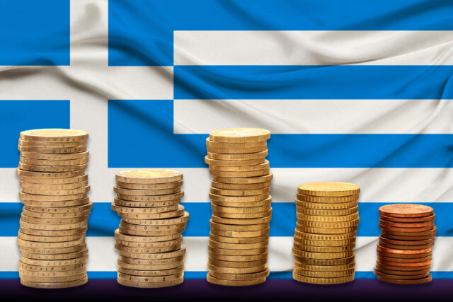 Stacks,Of,Euro,Currency,Coins,Against,The,Background,Of,The